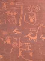 Light-colored carvings in red stone