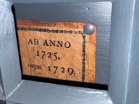 Town archive drawer behind locked grill